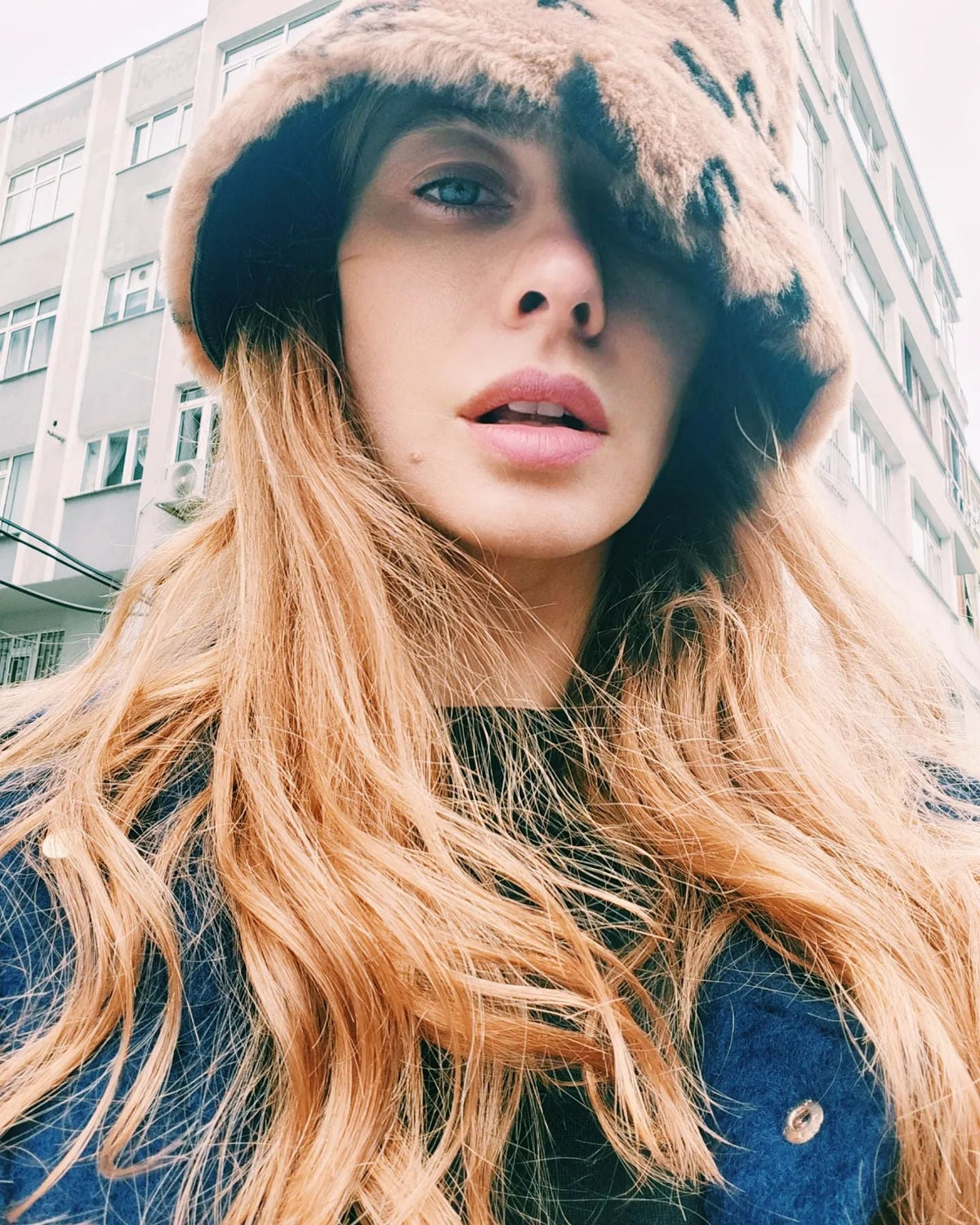 TUBA ÜNSAL IN BUCKET HAT